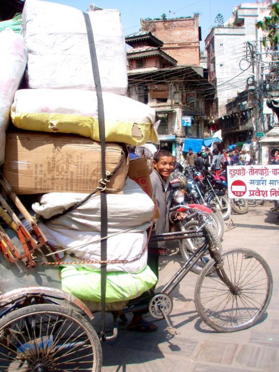 Person alongside tricycle in nepal