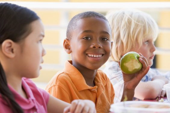 Child holding apple