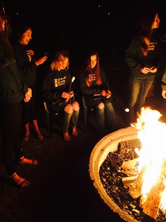 People sitting around a campfire