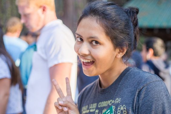 Person holding up peace sign