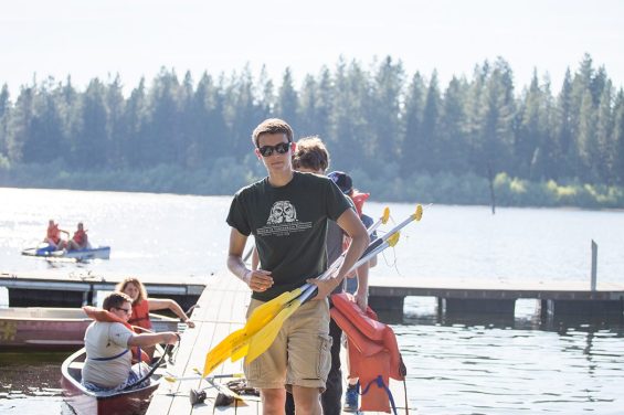 People holding boat oars