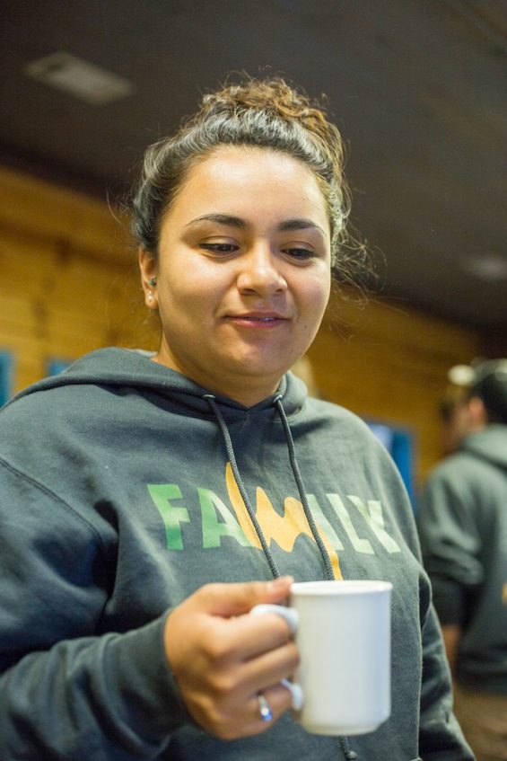 Person holding coffee cup