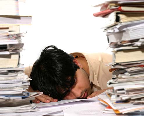 Person tired from paperwork