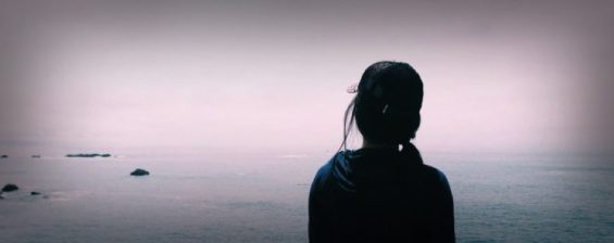 Person standing in front of ocean