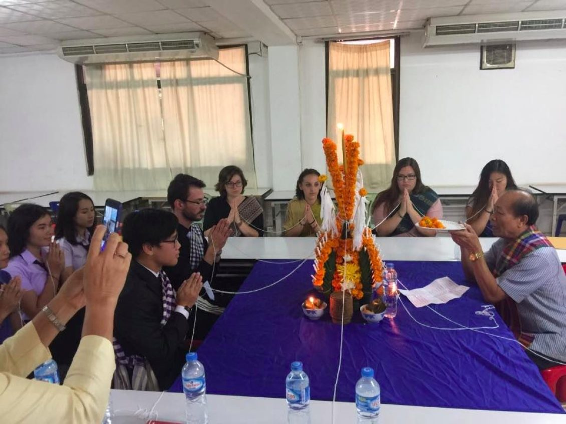 People praying around table