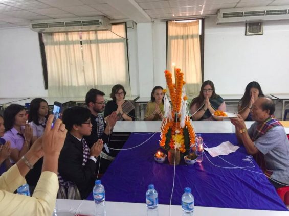 People praying around table