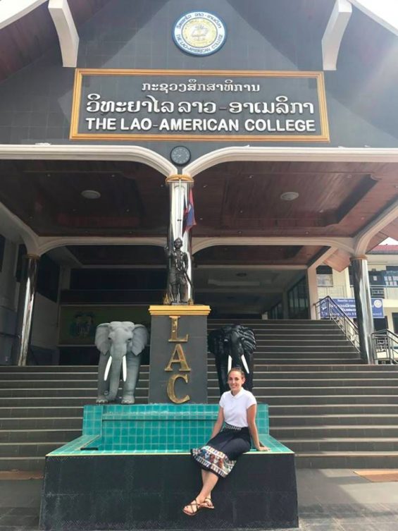 Person sitting on fountain