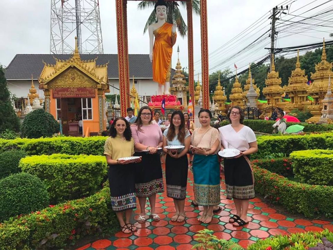 Group photo in front of statue