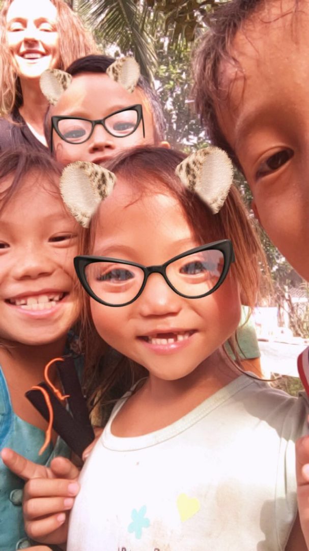 Children with digital filter of cat ears