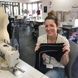 Person working at sewing machine