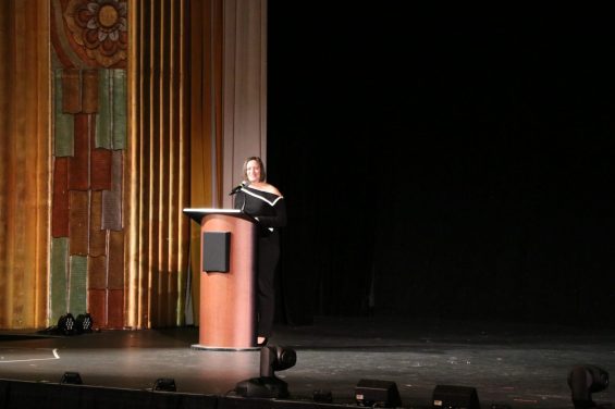 Person on a stage speaking