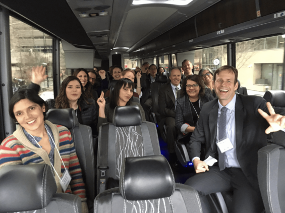 Group photo of people in a bus