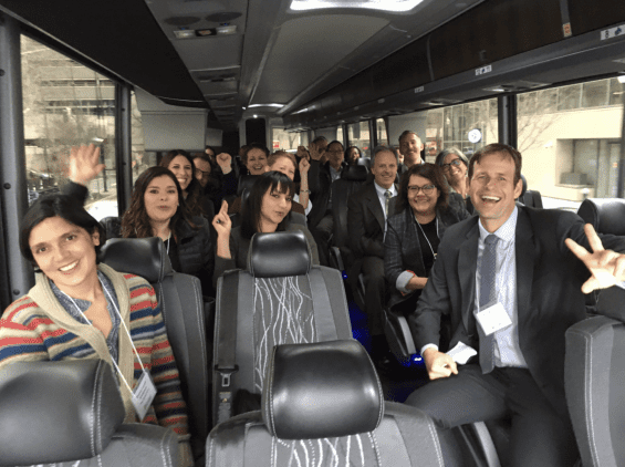 Group photo of people in a bus