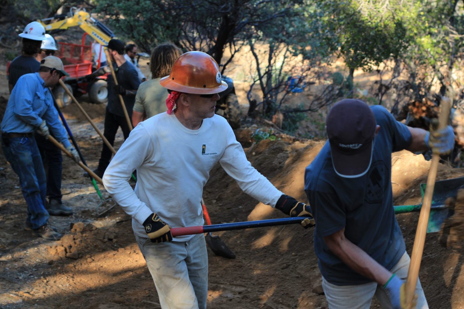 People shoveling dirt