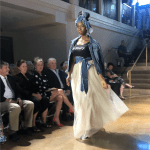 Woman walking down fashion show runway