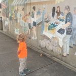 child looking at art