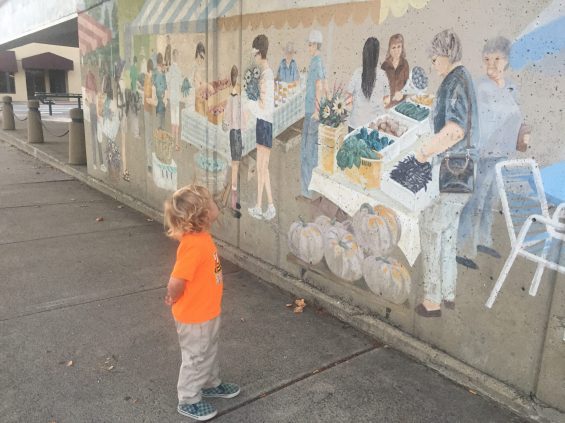 child looking at art
